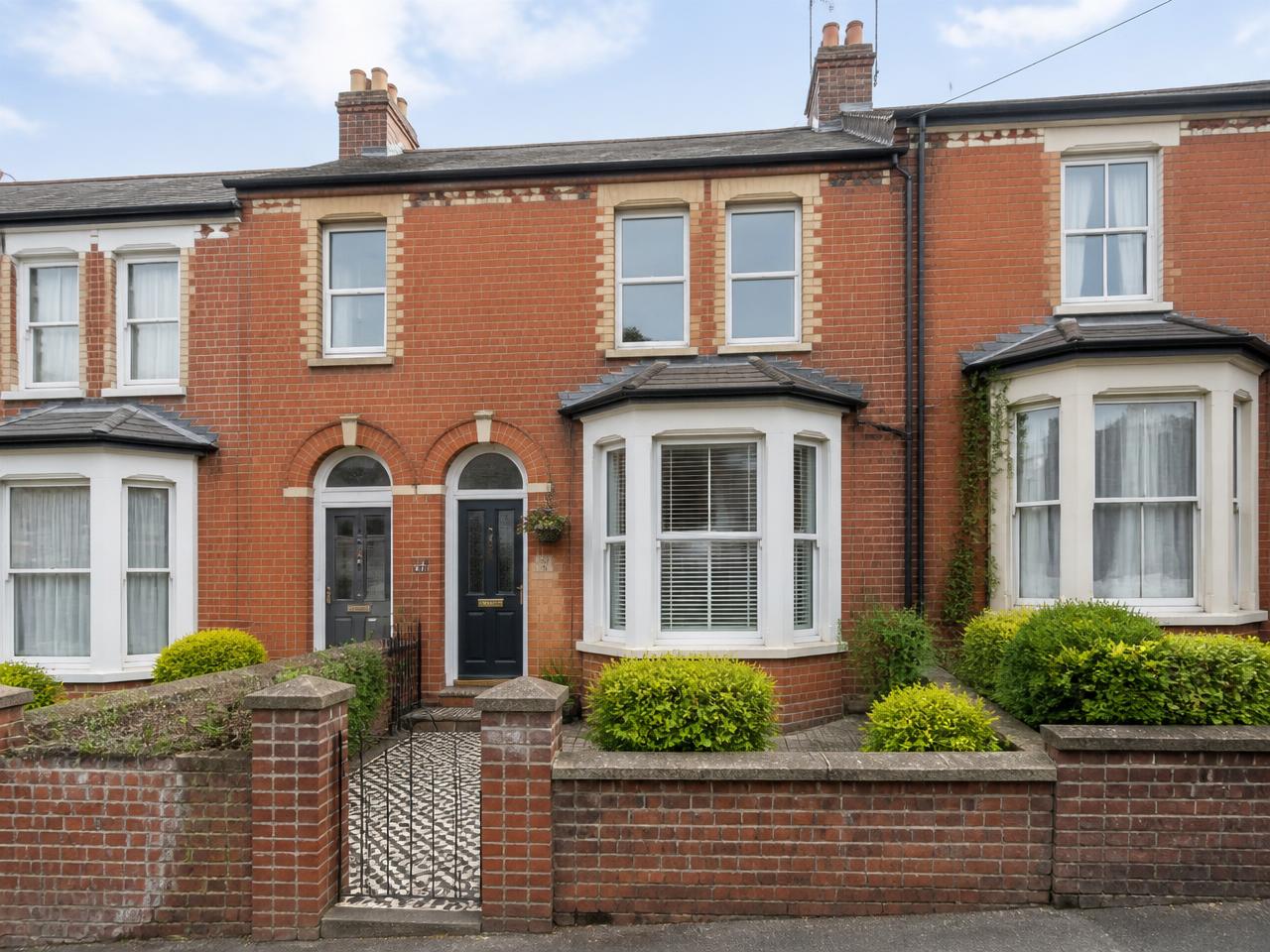 Red-brick Victorian terraced house exterior photographed for a property listing